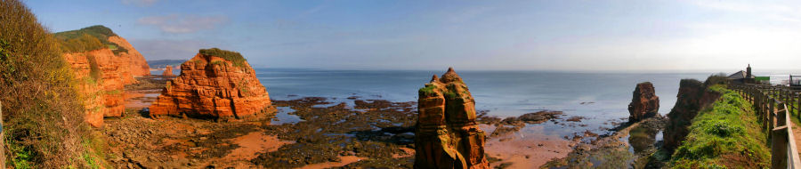 A panoramic photo of the sea stacks at Ladram Bay.